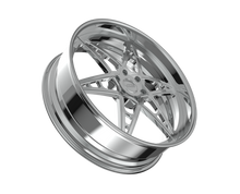 Chrome car wheel rim on black background.