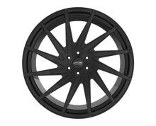 Black multi-spoke car wheel on black background.