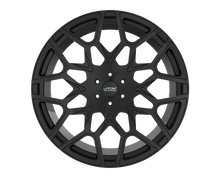 Black car wheel with intricate spoke design.
