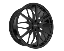 Black alloy wheel with intricate design.