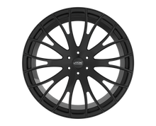 Black alloy wheel with intricate spoke design.