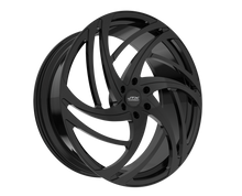 Black alloy wheel with intricate design.