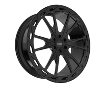 Black alloy wheel with intricate design.