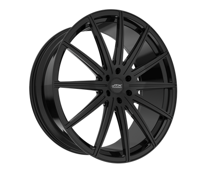 Black multi-spoke car wheel on black background.