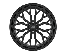 Black alloy wheel with intricate spoke design.