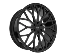 Black alloy car wheel with intricate design.