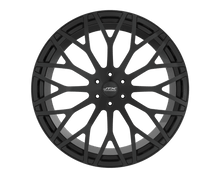 Black multi-spoke alloy wheel on black background.