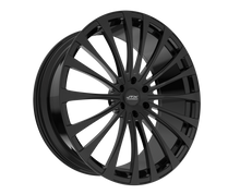 Black multi-spoke alloy wheel on black background.