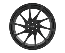 Black car wheel rim with intricate design.