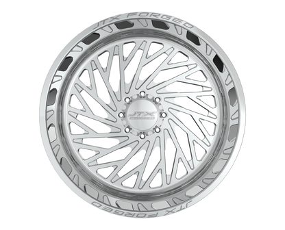 Intricate silver alloy wheel with geometric design.