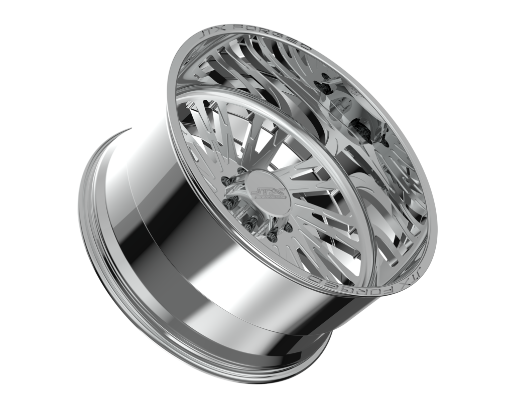 Chrome car wheel rim on black background.