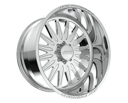 Chrome car wheel with intricate spoke design.