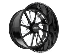 Black JTX Forged wheel with intricate design.
