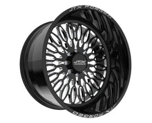 Black JTX Forged wheel with intricate design.