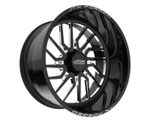 Black JTX Forged wheel with intricate design.