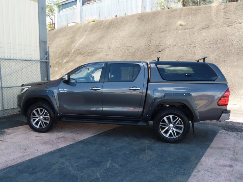 Toyota Hilux parked outdoors sporting EGR Fender Flares and off-road wheels