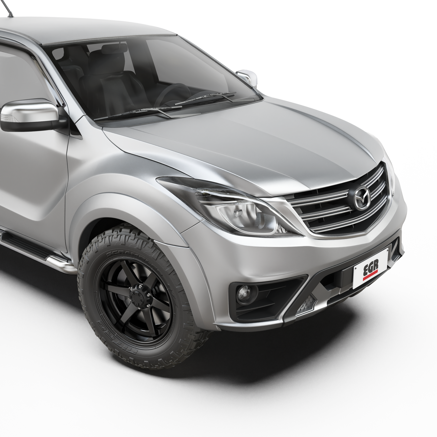 Front three-quarter view of a Mazda BT-50 with EGR Fender Flares installed, showcasing the rugged styling and enhanced wheel arch protection