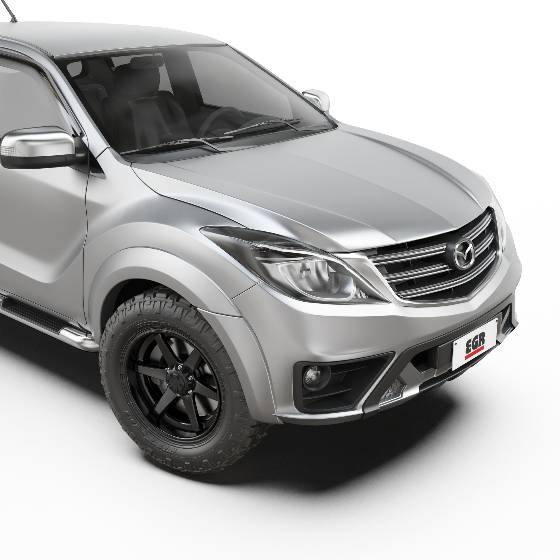 Front three-quarter view of a Mazda BT-50 with EGR Fender Flares installed, showcasing the rugged styling and enhanced wheel arch protection